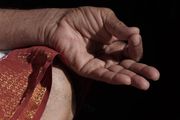 Close up of hands in a meditative pose